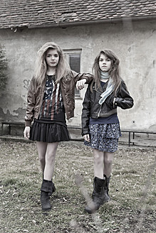 Germany, Bavaria, Two girls walking on backstreet - MAEF004524