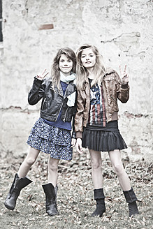 Germany, Bavaria, Two girls standing on backstreet - MAEF004526