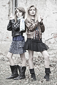 Germany, Bavaria, Two girls standing on backstreet - MAEF004527