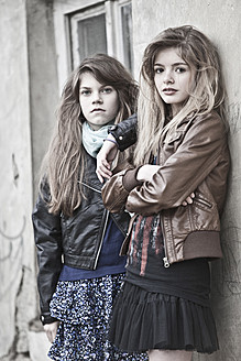 Germany, Bavaria, Two girls standing on backstreet - MAEF004528