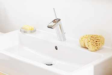 Germany, Bavaria, Bathroom sink with soap and sponge - MAEF004573