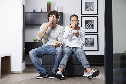 Germany, Bavaria, Young couple watching TV - MAEF004625