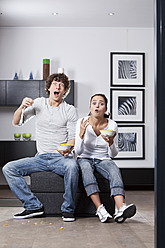 Germany, Bavaria, Young couple watching TV - MAEF004626