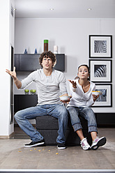 Germany, Bavaria, Young couple watching TV - MAEF004627