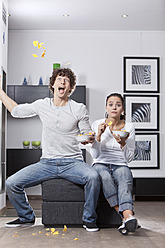 Germany, Bavaria, Young couple watching TV - MAEF004628