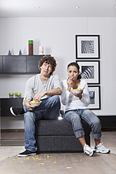 Germany, Bavaria, Young couple watching TV - MAEF004629