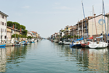 Italy, Friuli, Grado, Moored boats in canal - HHF004151