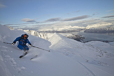 Norway, Mature man skiing on step mountain - FFF001309