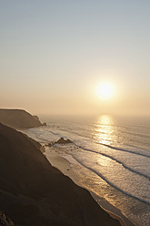 Portugal, Algarve, Sagres, View of beach at sunset - MIRF000423