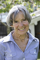 Germany, Bavaria, Senior woman smiling, portrait - TCF002582