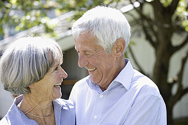 Germany, Bavaria, Senior couple looking at each other, smiling - TCF002590