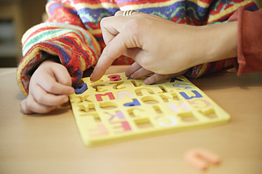 Germany, Bavaria, Girl learning spelling - TCF002649