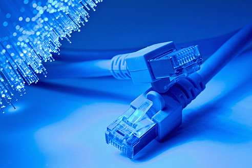 USB cable in front of blue fiber lights, close up - TSF000361