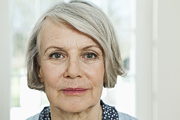 Germany, Berlin, Senior woman smiling, portrait - FMKYF000064