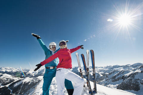 Austria, Salzburg, Young couple standing on top of mountain stock photo