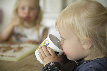 Germany, Bavaria, Girl drinking from cup - TCF002711