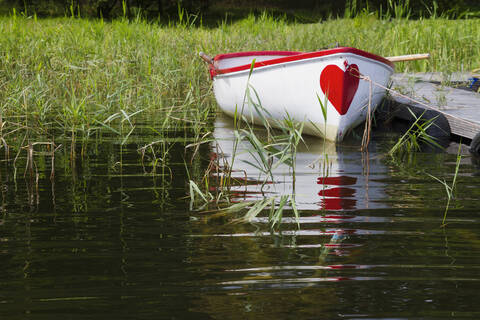 Germany, Usedom, Rowing boat moored by Kachliner lake stock photo