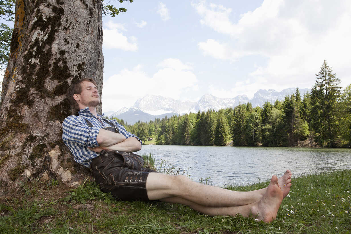 Human Relaxing Tree Under Stock Photos - Free & Royalty-Free Stock Photos  from Dreamstime