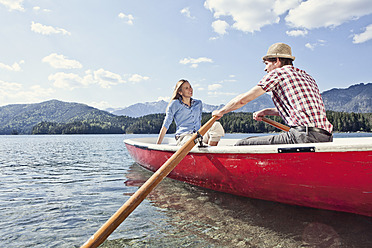 Germany, Bavaria, Couple in rowing boat, smiling - RBF000923