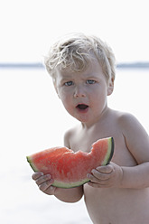 Germany, Bavaria, Boy eating watermelon, close up - TCF002738