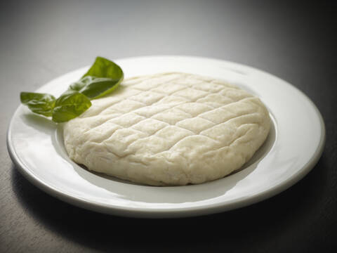 Germany, Cologne, French soft cheese with basil, close up stock photo