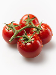 Wet tomatoes on white background, close up - KSWF000859