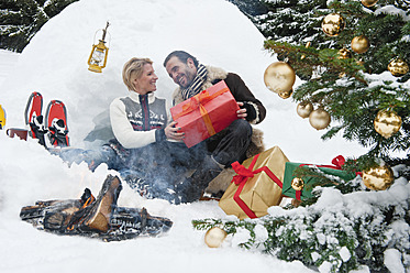 Austria, Salzburg County, Couple celebrating christmas in nature, smiling - HHF004270
