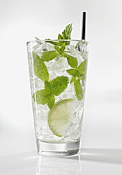 Glass of mojito with mint on white background, close up - KSWF000993