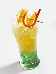 Glass of iced orange juice on white background - KSWF000986