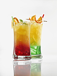 Glasses of tequila sunrise and mojito on white background - KSWF000982