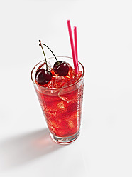 Glass of cherry iced tea on white background - KSWF000980
