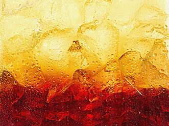 Tequila sunrise in glass, close up - KSWF000979