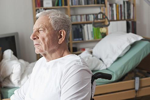 Germany, Leipzig, Senior man sitting on wheelchair - WESTF018841