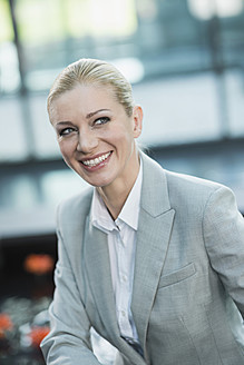 Germany, Stuttgart, Businesswoman smiling - MFPF000218