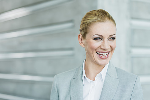 Germany, Stuttgart, Businesswoman smiling - MFPF000221