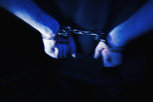 Close up of handcuffs on man wrist - TLF000672