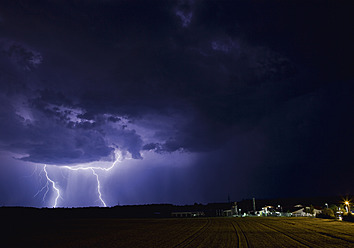 Germany, Bavaria, Sauerlach, Lightning flashes in night - WBF001226