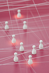Netzwerk mit Figurine auf rosa Hintergrund - ASF004591