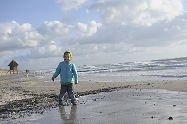 Germany, Mecklenburg Western Pomerania, Boy standing on Baltic Sea - MJF000111