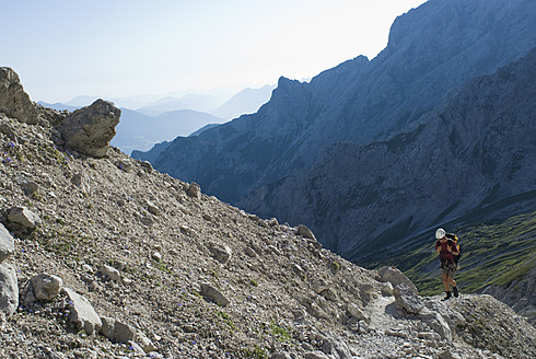 Germany, Bavaria, Man climbing mountain - KAF000024