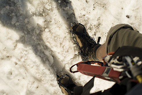 Germany, Bavaria, Man climbing mountain - KAF000020