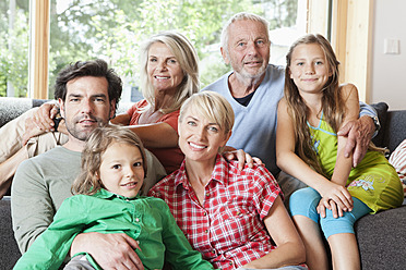 Germany, Bavaria, Numerberg, Portrait of family in living room - RBYF000141