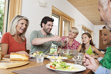 Germany, Bavaria, Nuremberg, Family having lunch together - RBYF000152