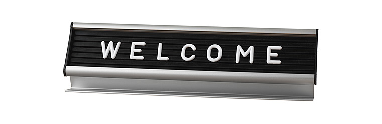 Welcome sign on white background, close up - WBF001578