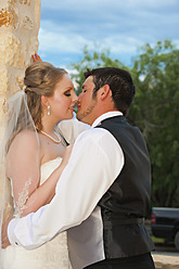 USA, Texas, Bride and groom romancing, close up - ABAF000250