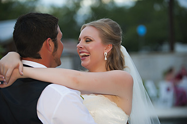 USA, Texas, Bride and groom romancing, close up - ABAF000244