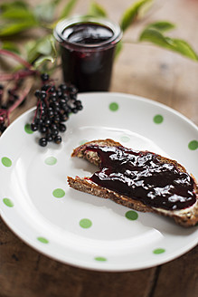 Slice of bread with elder jelly in plate - VRF000079