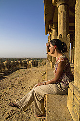 India, Rajasthan, Jaisalmer, Tourist at Bada Bagh Cenotaphs - MBEF000505