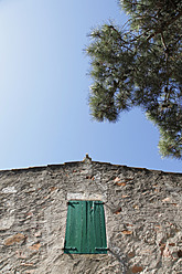 Spain, Costa Brava, Catalonia, House with window and tree - JMF000198