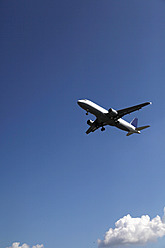 Germany, Berlin, Aeroplane flying in air at Tegel - JMF000231